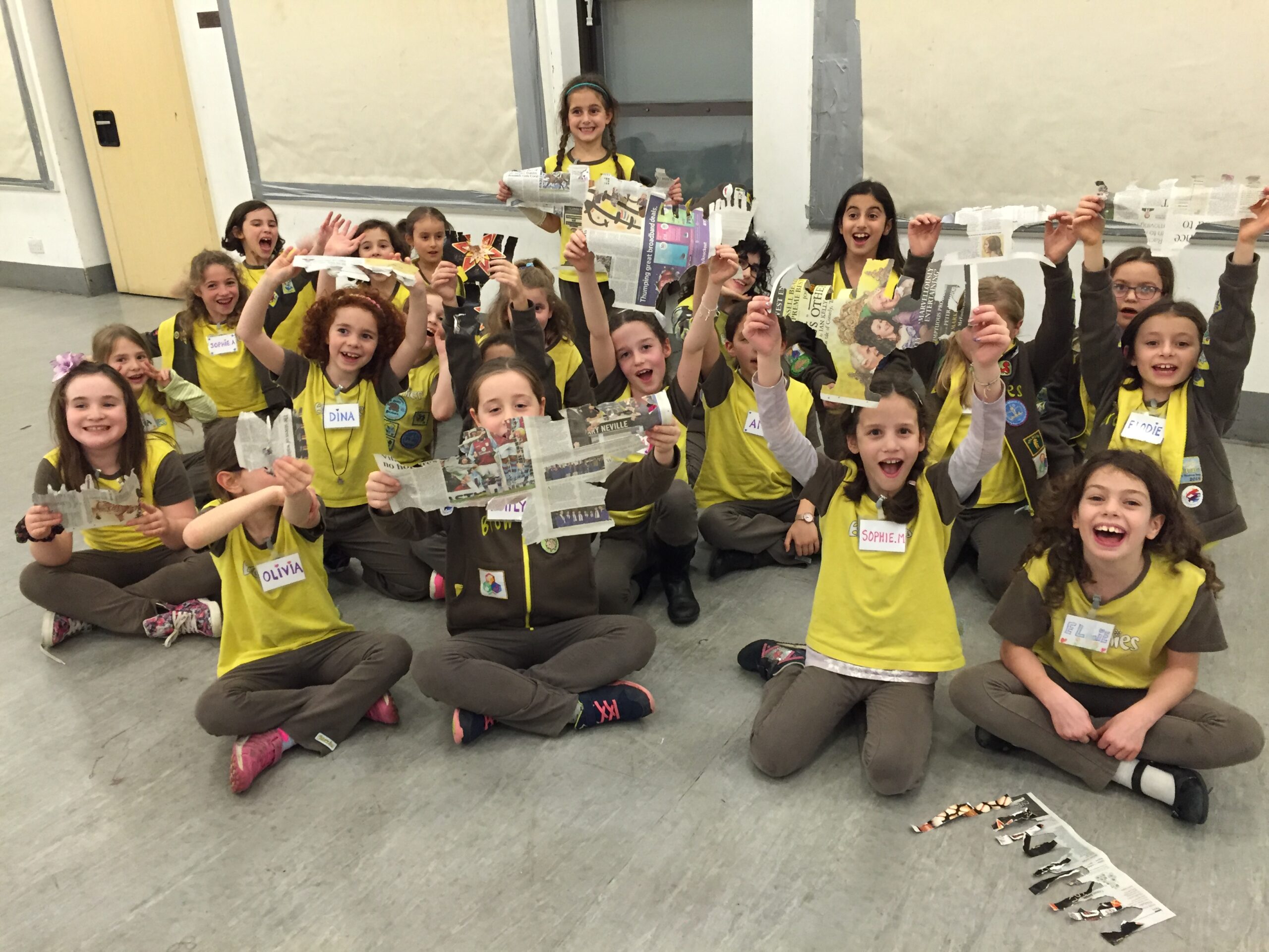 Brownies Making a Menorah by Tearing Newspaper
