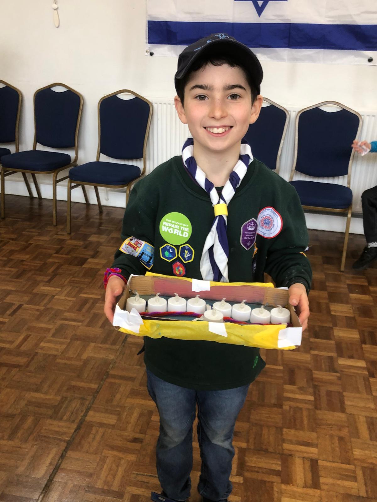 20th Finchley Scouts make a Chanukiah for Jewish Care for Mitzvah Day 2024