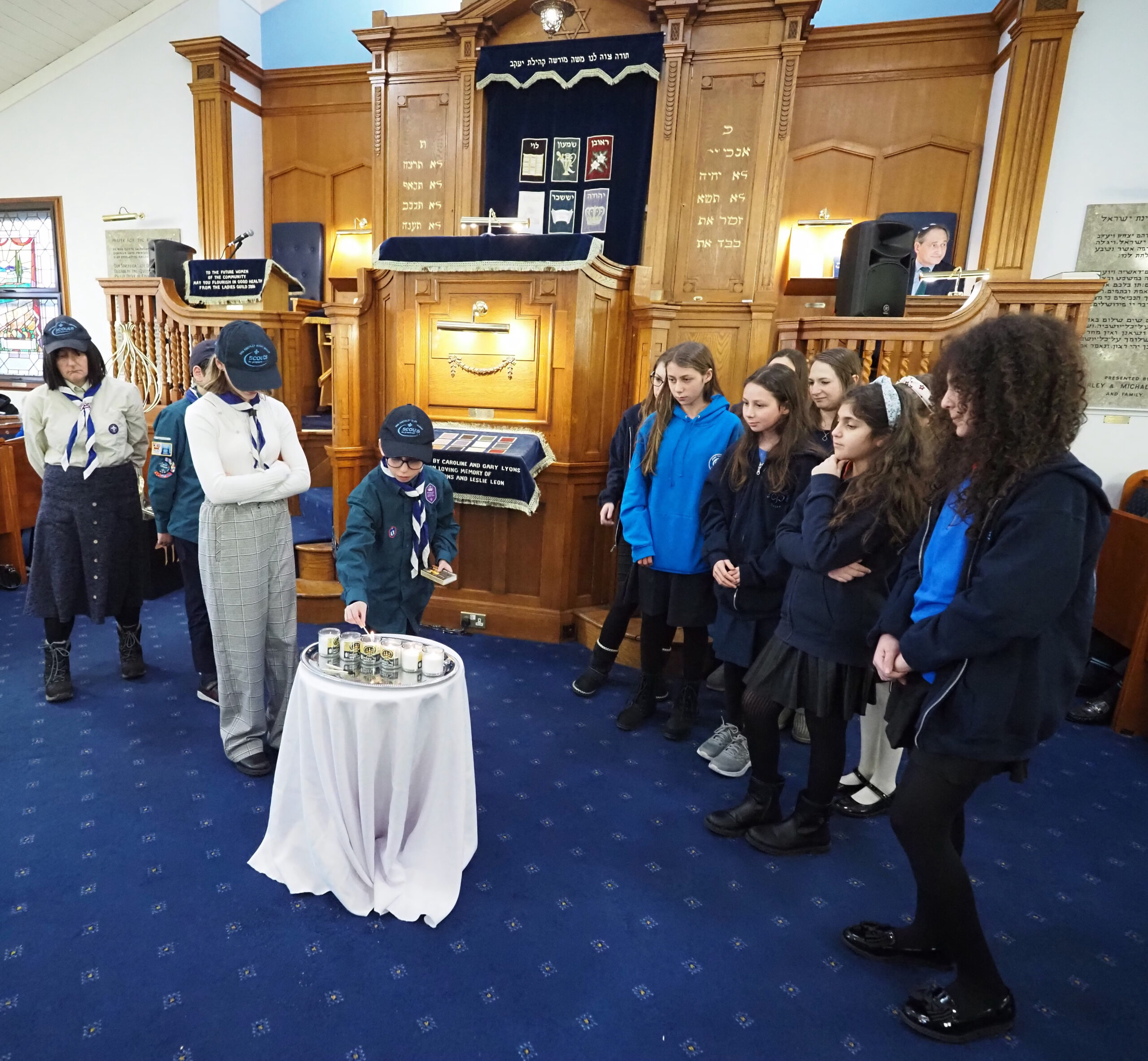 Lighting of the 6 Memorial Candles by 5th North Finchley Guides and 20th North Finchley Scouts