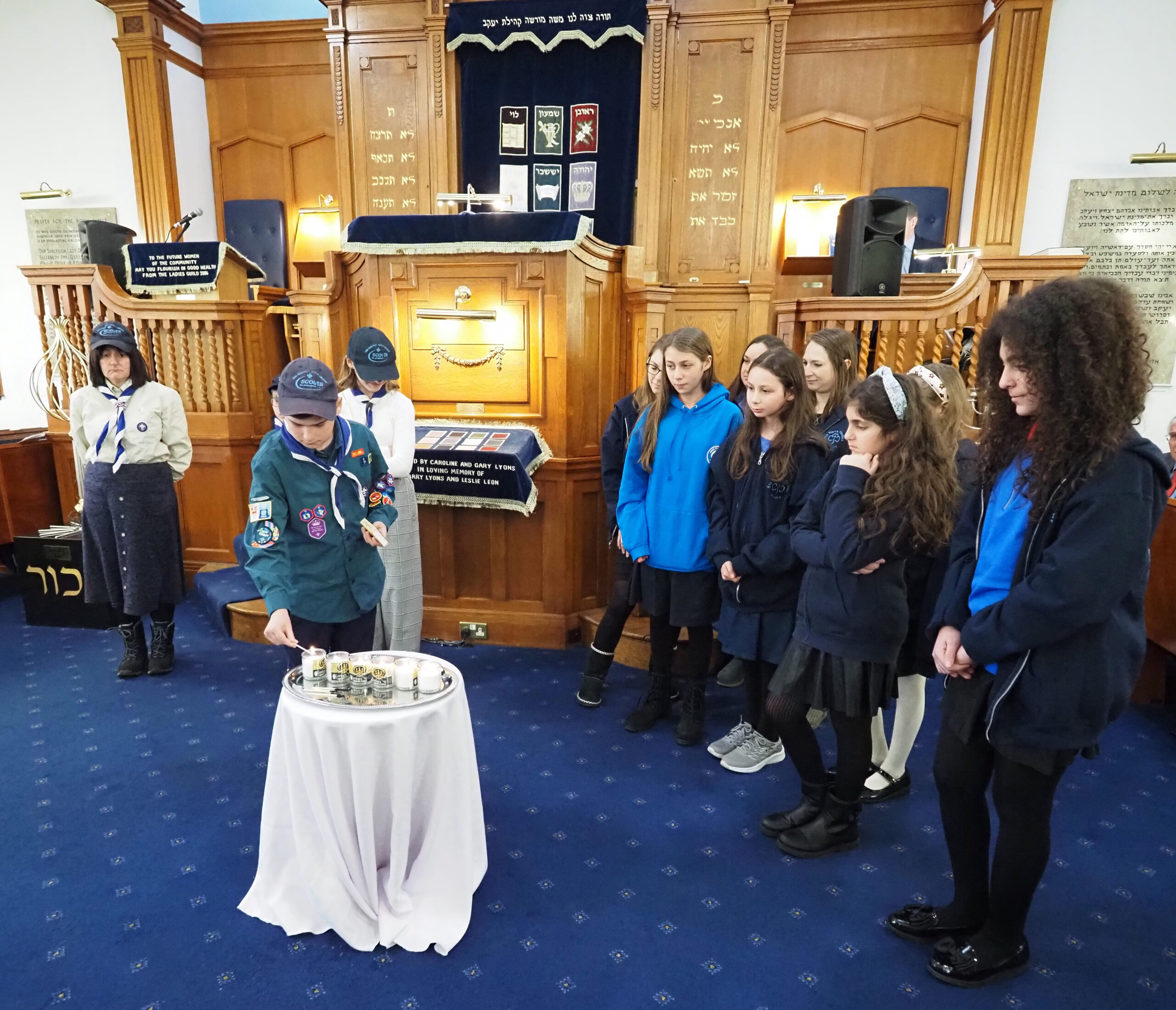 Lighting of the 6 Memorial Candles by 5th North Finchley Guides and 20th North Finchley Scouts