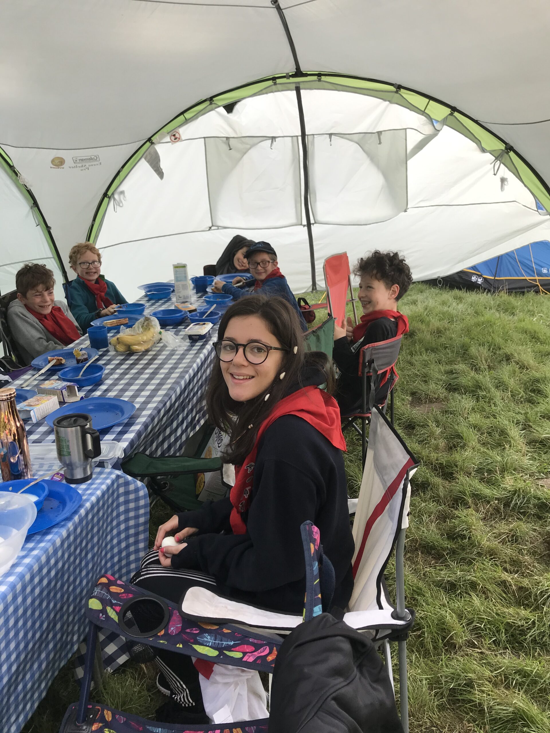 Scouts eating breakfast at camp